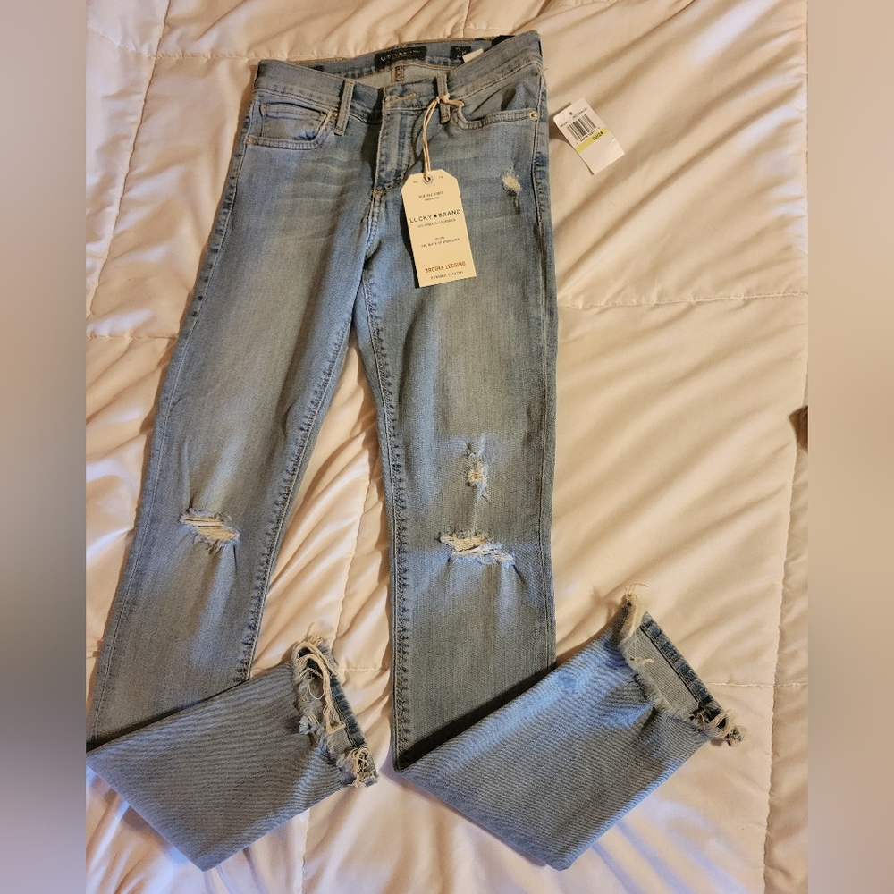 Lucky brand jeans size 00 distressed on knees and ankles never worn.